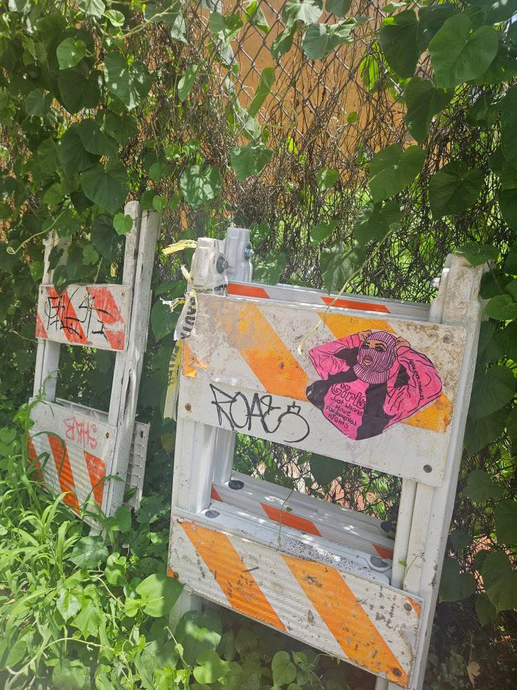 Street art by Alaina featuring hand-painted paste-ups and bold imagery centered on the female body, autonomy, and resistance in public space.