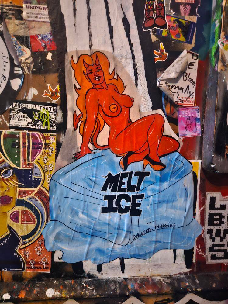 Street art by Alaina featuring hand-painted paste-ups and bold imagery centered on the female body, autonomy, and resistance in public space.